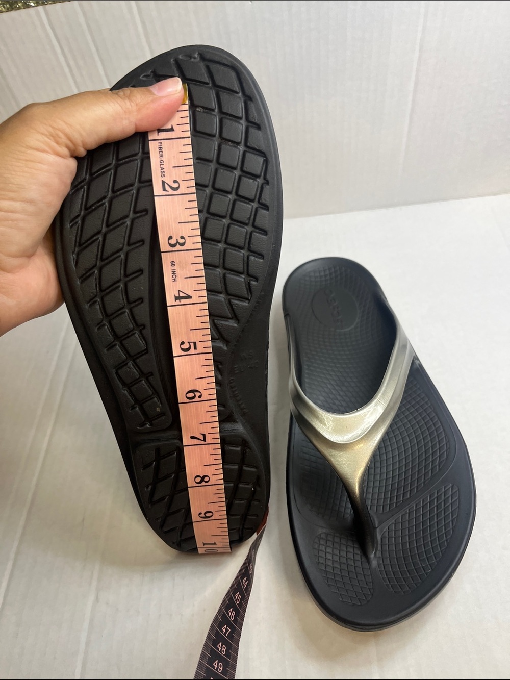 OOFOS Women's Black Flip Flop Sandals with Metallic Silver Straps - Picture 11 of 12